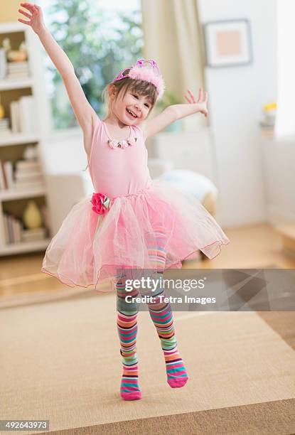 girl (4-5) wearing tutu dancing in living room, jersey city, new jersey, usa - tutu stock pictures, royalty-free photos & images