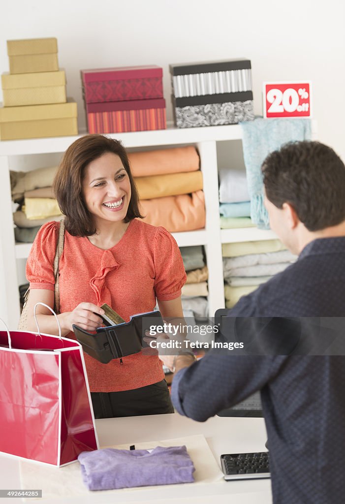 Customer paying in store, Jersey City, New Jersey, USA