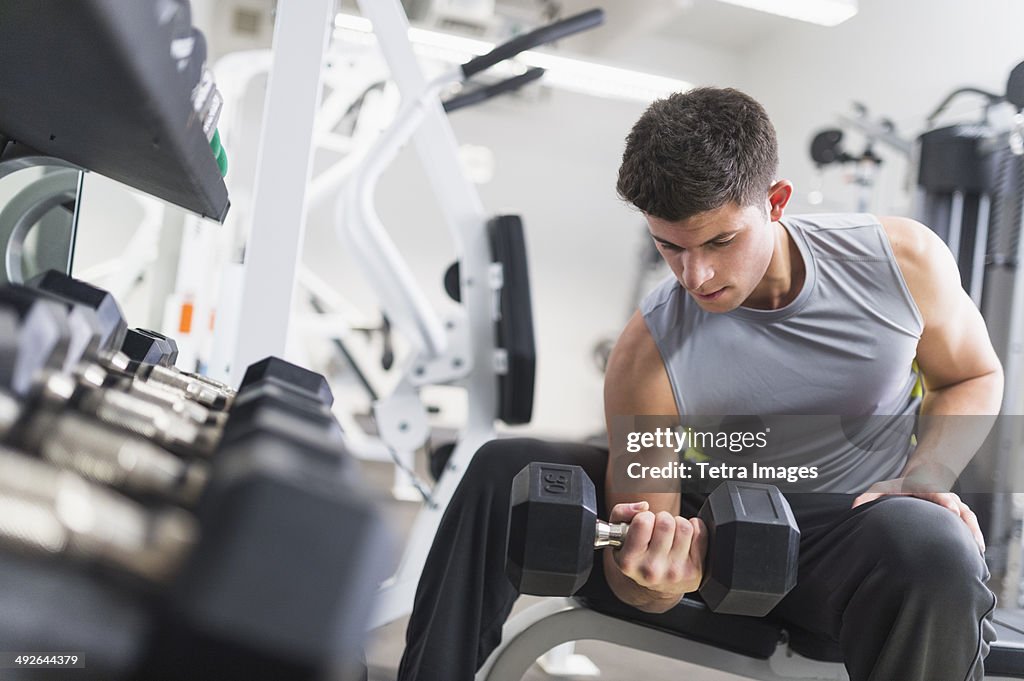 Young man working out at gym, Jersey City, New Jersey, USA