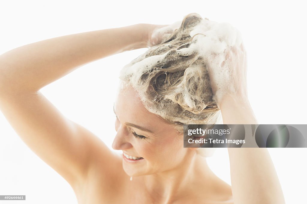 Beautiful woman washing hair