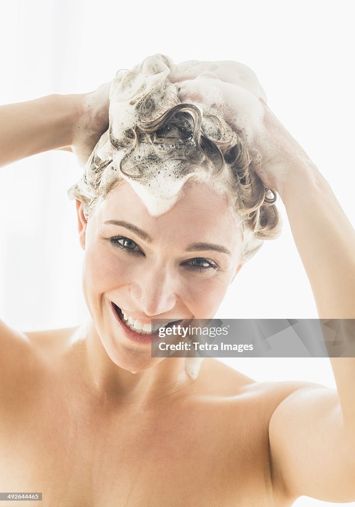 Beautiful woman washing hair