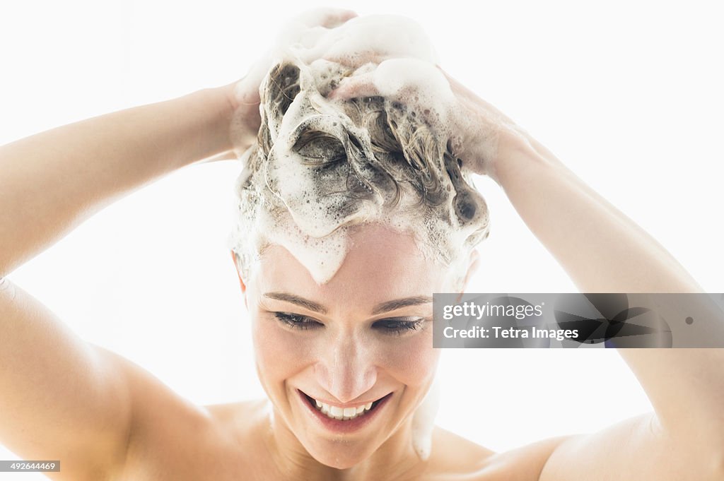 Beautiful woman washing hair