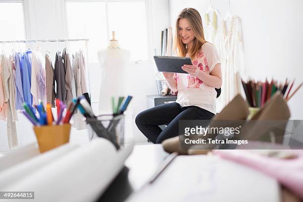 portrait of female costume designer using digital tablet in studio, jersey city, new jersey, usa - kostymdesigner bildbanksfoton och bilder