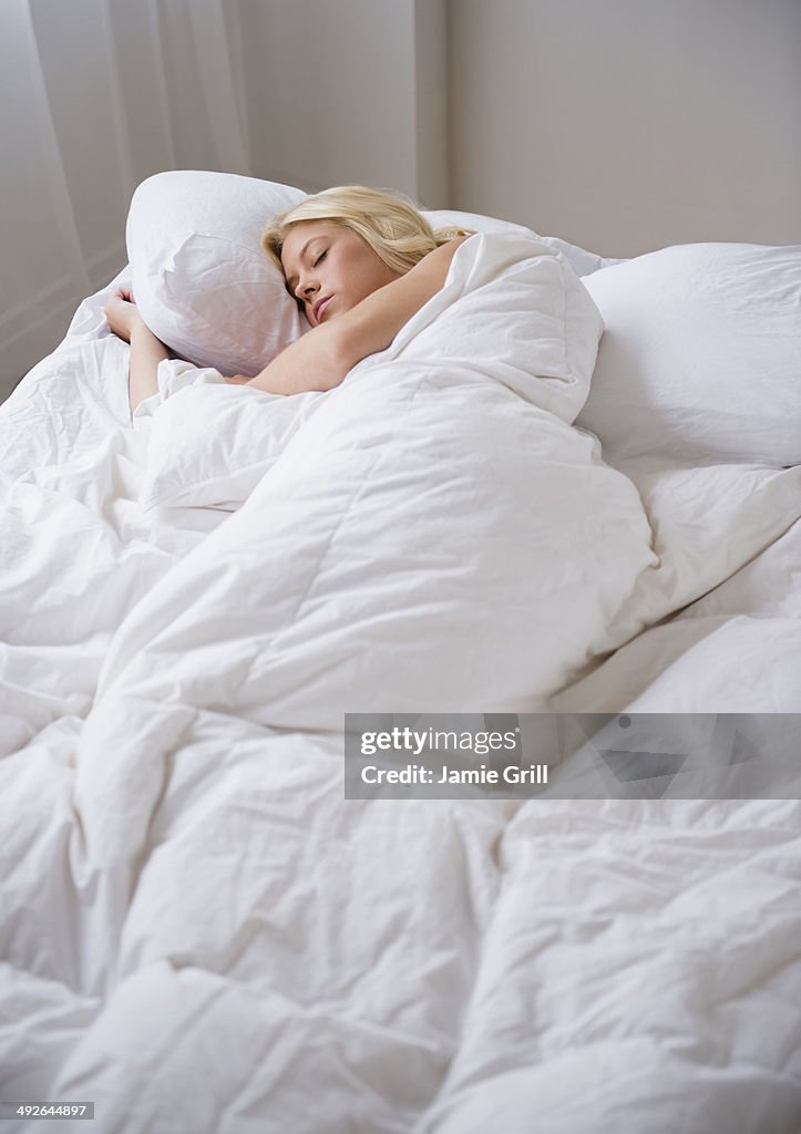 Young woman sleeping, Jersey City, New Jersey, USA