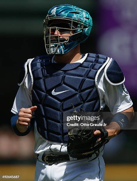 Catcher John Buck of the Seattle Mariners looks on against the Tampa Bay Rays at Safeco Field on May 14, 2014 in Seattle, Washington.