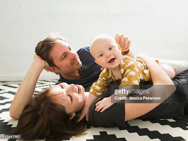 portrait of parents with baby son (2-5 months) - mum dad and baby fotografías e imágenes de stock