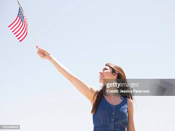 portrait of young woman with american flag, salt lake city, utah, usa - utah flag stock pictures, royalty-free photos & images