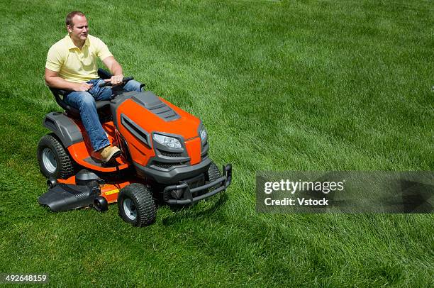 man mowing lawn - riding lawnmower stock pictures, royalty-free photos & images