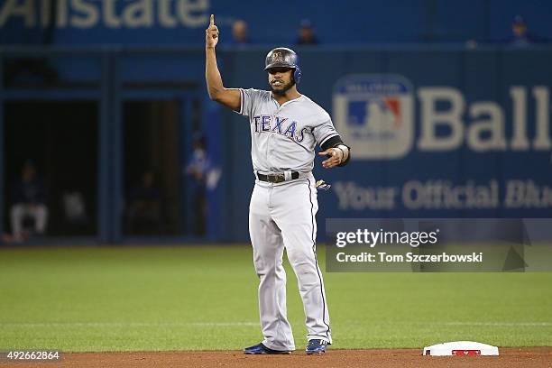 Delino DeShields of the Texas Rangers reacts after hitting a double in the first inning against the Toronto Blue Jays in game five of the American...