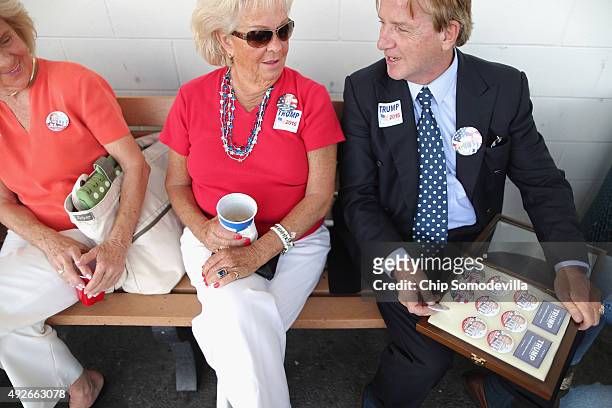 Nell Walker and Jeannie Stagg of Virginia Beach, VA, and Richard Snowden of Nashville, TN, wait at the head of the line of people waiting to get into...