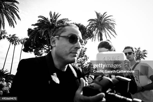 Fans wait for spare tickets during the 67th Annual Cannes Film Festival on May 21, 2014 in Cannes, France.