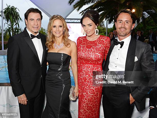 John Travolta, Kelly Preston, Tamara Ecclestone and Jay Rutland attend the welcome party for Puerto Azul Experience Night at Villa St George on May...