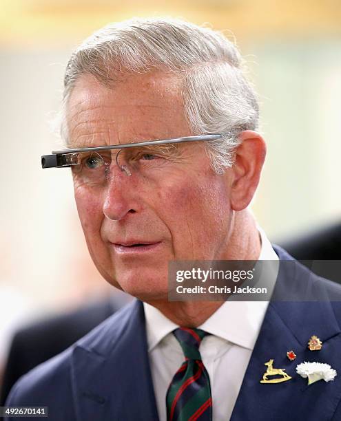 Prince Charles, Prince of Wales tries on 'Google Glass' spectacles as he visits 'Innovation Alley' on May 21, 2014 in Winnipeg, Canada. The Prince of...