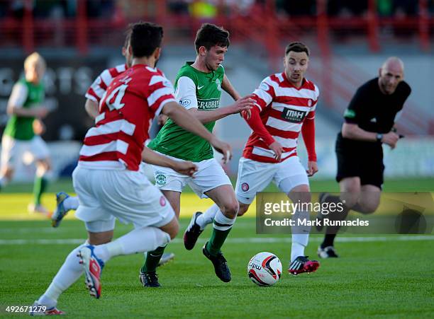 Samuel Stanton of Hibernian breaks through the defence of Hamilton Academical during the Scottish Premiership Play-off Final First Leg, between...