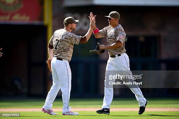 Chase Headley celebrates with Will Venable of the San Diego Padres after the final out in the game against the Miami Marlins at Petco Park on May 11,...