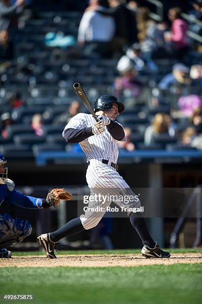 Scott Sizemore of the New York Yankees bats during the game against the Chicago Cubs at Yankee Stadium on April 16, 2014 in the Bronx borough of New...