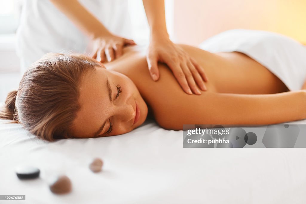 Spa Woman. Female Enjoying Massage in Spa Centre.