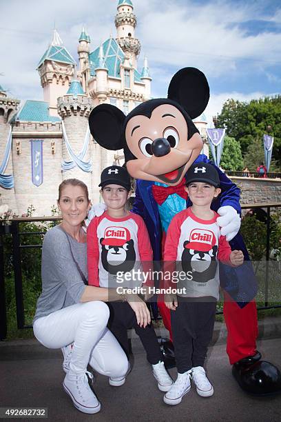 In this handout image provided by Disneyland Resort, Celine Dion and twin sons Eddy and Nelson, age 4, celebrate the boys' upcoming fifth birthday...