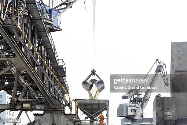 crane grab transferring goods in port - basel port stock pictures, royalty-free photos & images