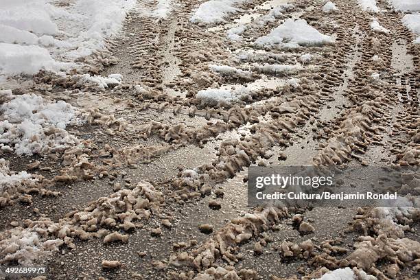 snow and slush with tire tracks - snösörja bildbanksfoton och bilder