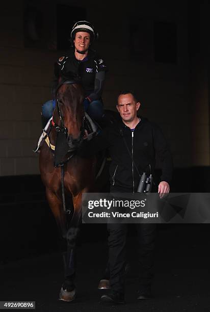 Justine Hales riding Winx walks onto the track with trainer Chris Waller during a trackwork session at Moonee Valley Racecourse on October 15, 2015...