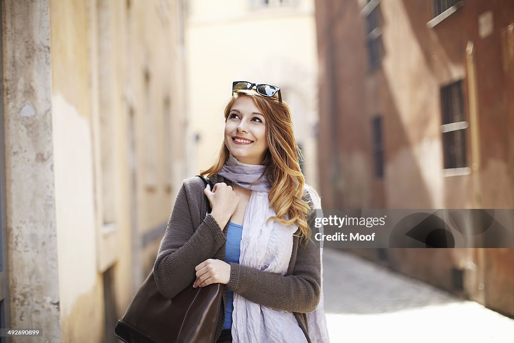 Young sophisticated woman exploring streets, Rome, Italy