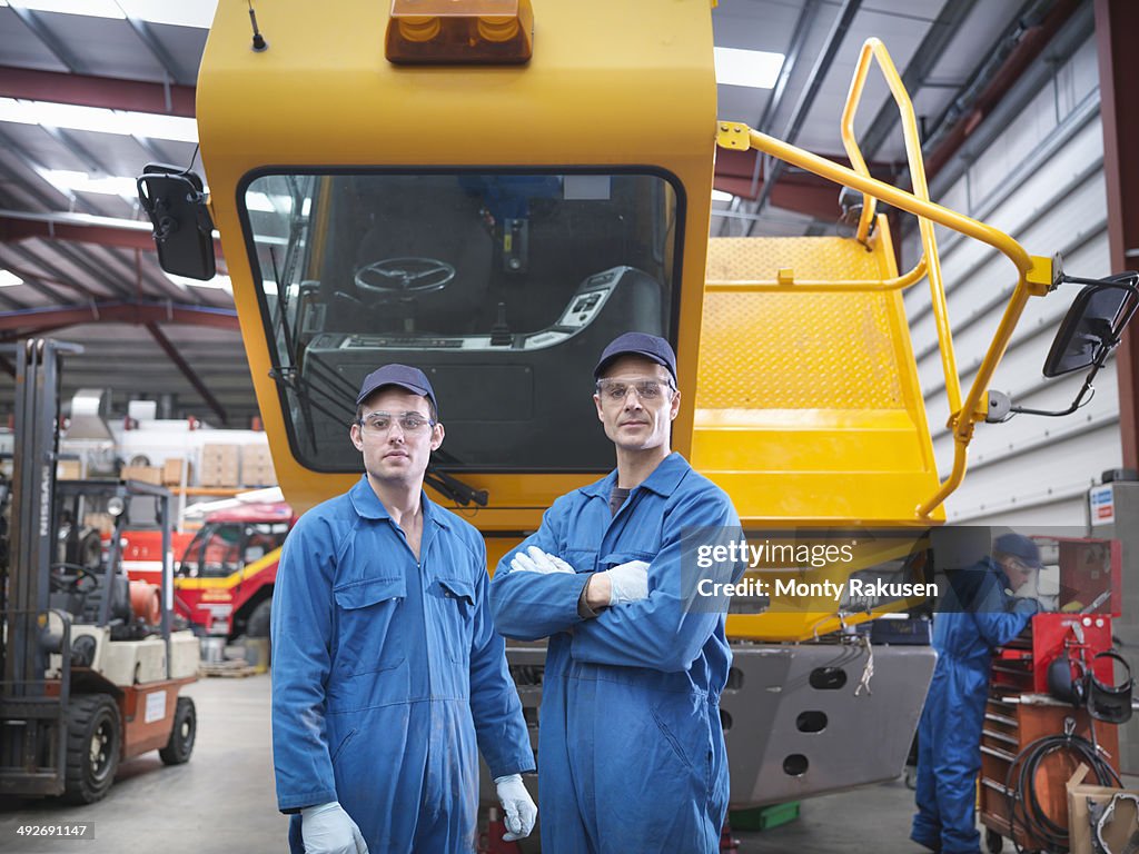Portrait of engineers in truck repair factory