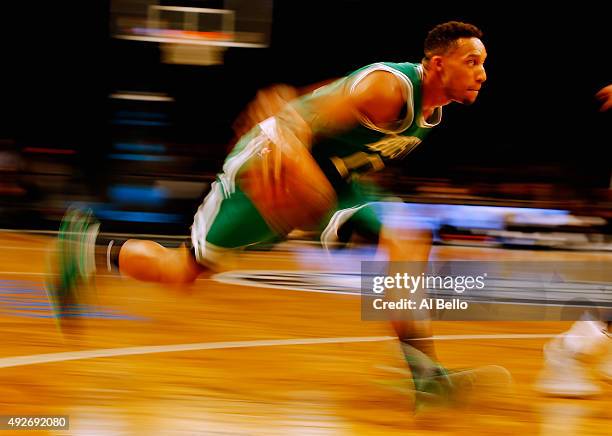 Evan Turner of the Boston Celtics dribbles against the Brooklyn Nets during their Preseason game at Barclays Center on October 14, 2015 in New York...