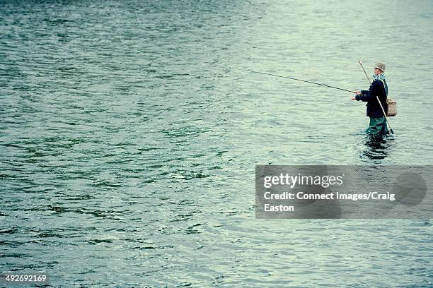 Young Woman Fishing, Foto de stock