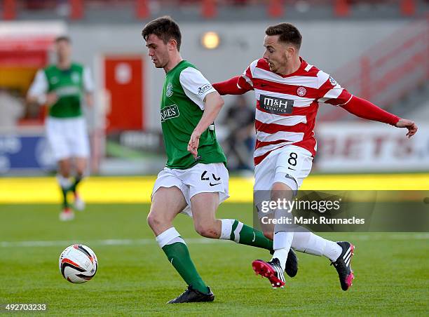 Samuel Stanton of Hibernian outruns Jon Routledge of Hamilton Academical during the Scottish Premiership Play-off Final First Leg, between Hamilton...