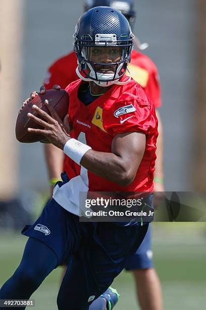 Quarterback Keith Price of the Seattle Seahawks passes during Rookie Minicamp at the Virginia Mason Athletic Center on May 17, 2014 in Renton,...
