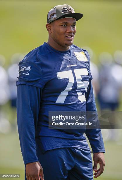 Tackle Garrett Scott of the Seattle Seahawks looks on during Rookie Minicamp at the Virginia Mason Athletic Center on May 17, 2014 in Renton,...