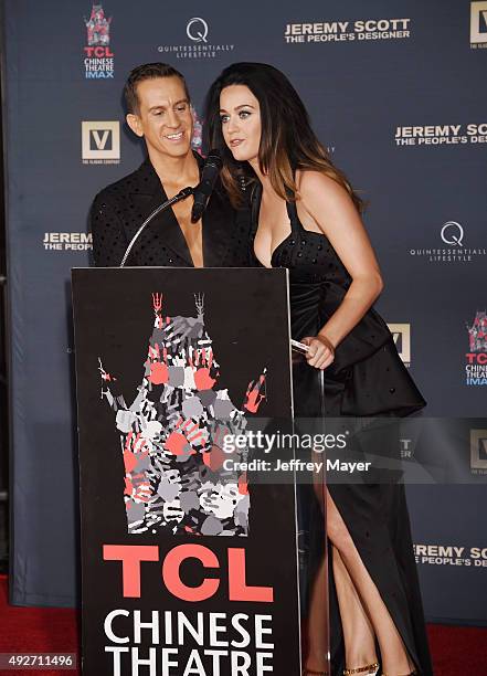 Fashion designer Jeremy Scott and singer Katy Perry at the Jeremy Scott And Katy Perry Hand Print Ceremony At TCL Chinese IMAX Forecourt on September...
