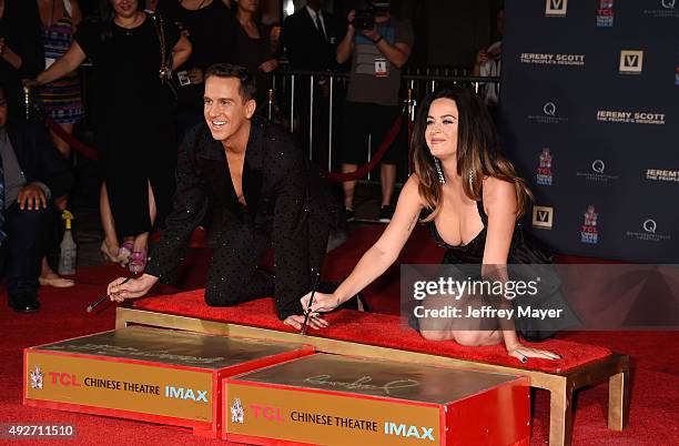 Fashion designer Jeremy Scott and singer Katy Perry at the Jeremy Scott And Katy Perry Hand Print Ceremony At TCL Chinese IMAX Forecourt on September...
