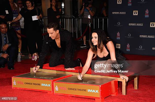 Fashion designer Jeremy Scott and singer Katy Perry at the Jeremy Scott And Katy Perry Hand Print Ceremony At TCL Chinese IMAX Forecourt on September...