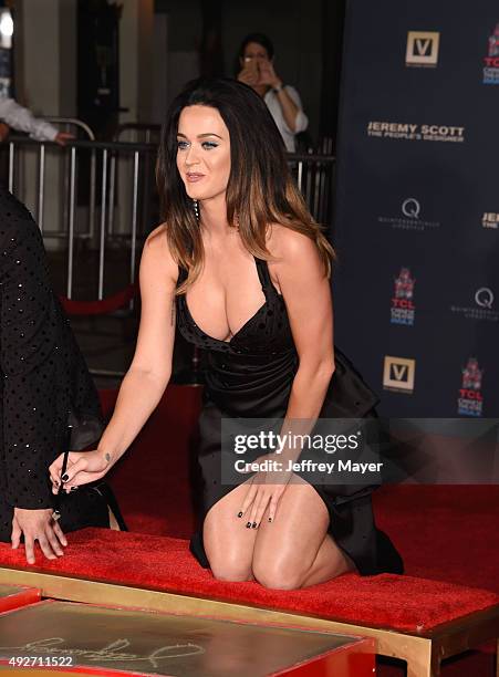 Fashion designer Jeremy Scott and singer Katy Perry at the Jeremy Scott And Katy Perry Hand Print Ceremony At TCL Chinese IMAX Forecourt on September...