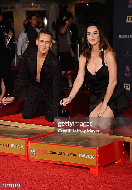 Fashion designer Jeremy Scott and singer Katy Perry at the Jeremy Scott And Katy Perry Hand Print Ceremony At TCL Chinese IMAX Forecourt on September...