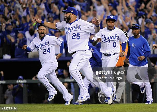 Kendrys Morales of the Kansas City Royals celebrates with teammates after defeating the Houston Astros 7-2 in game five of the American League...