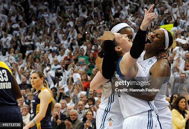 Lindsay Whalen, Maya Moore and Sylvia Fowles of the Minnesota Lynx celebrate a win in Game Five of the 2015 WNBA Finals against the Indiana Fever on...