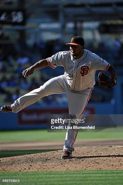 Jean Machi of the San Francisco Giants pitches against the Los Angeles Dodgers at Dodger Stadium on May 11, 2014 in Los Angeles, California.