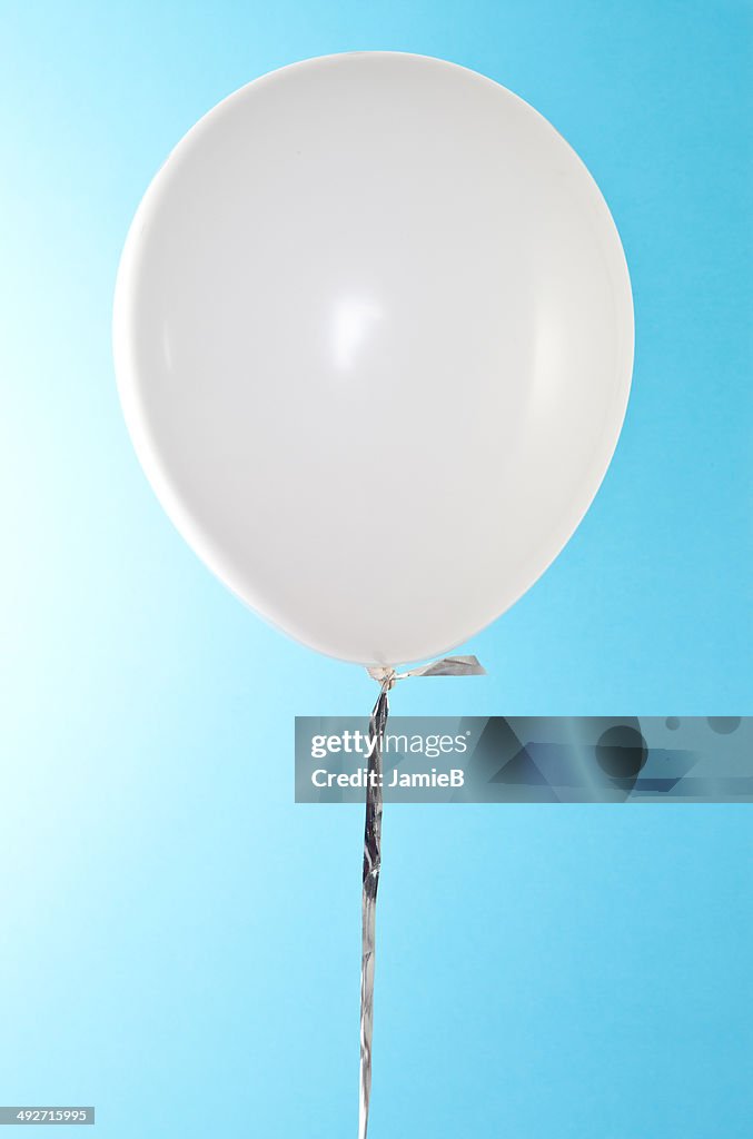 White Balloon against blue sky