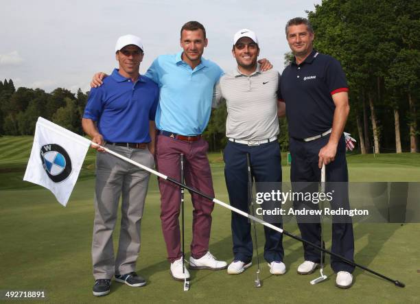 Former footballers Gianfranco Zola, Andriy Shevchenko and Daniele Massaro pose with Francesco Molinari of Italy during the Pro-Am ahead of the BMW...