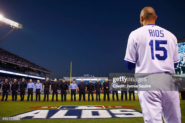 Firefighters stand on the field to honor two KCFD firefighters who lost their lives battling a structure fire earlier in the week prior to game five...