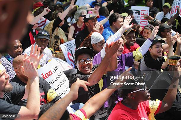 Fast food workers and activists demonstrate outside the McDonald's corporate campus on May 21, 2014 in Oak Brook, Illinois. The demonstrators were...