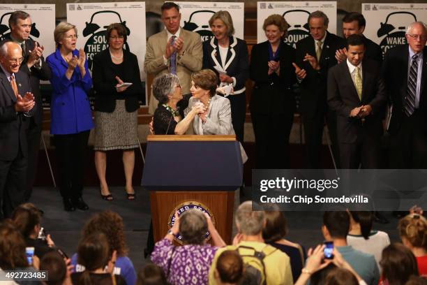 Senate Environment and Public Works Chairwoman Barbara Boxer embraces House Minority Leader Nancy Pelosi join members of the House of Representatives...
