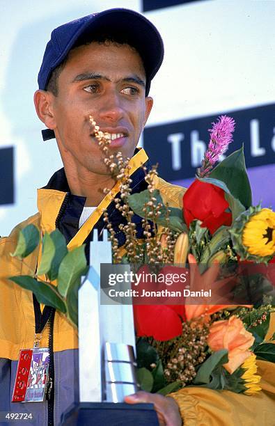 Khalid Khannouchi receives his trophy and flowers after winning the LaSalle Banks Chicago Marathon in Chicago, IllinoisMandatory Credit: Jonathan...