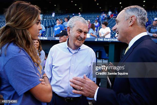 Kansas City Royals owner David Glass, center, speaks with Commissioner of Baseball Rob Manfred prior to game five of the American League Divison...