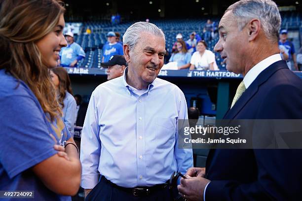 Kansas City Royals owner David Glass, center, speaks with Commissioner of Baseball Rob Manfred prior to game five of the American League Divison...