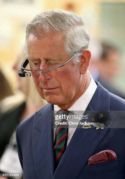 Prince Charles, Prince of Wales tries on 'Google Glass' spectacles as he visits 'Innovation Alley' on May 21, 2014 in Winnipeg, Canada. The Prince of...
