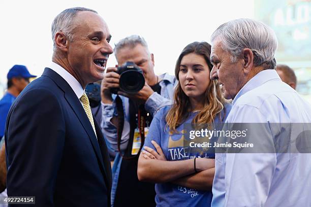 Commissioner of Baseball Rob Manfred, left, speaks with Kansas City Royals owner David Glass prior to game five of the American League Divison Series...